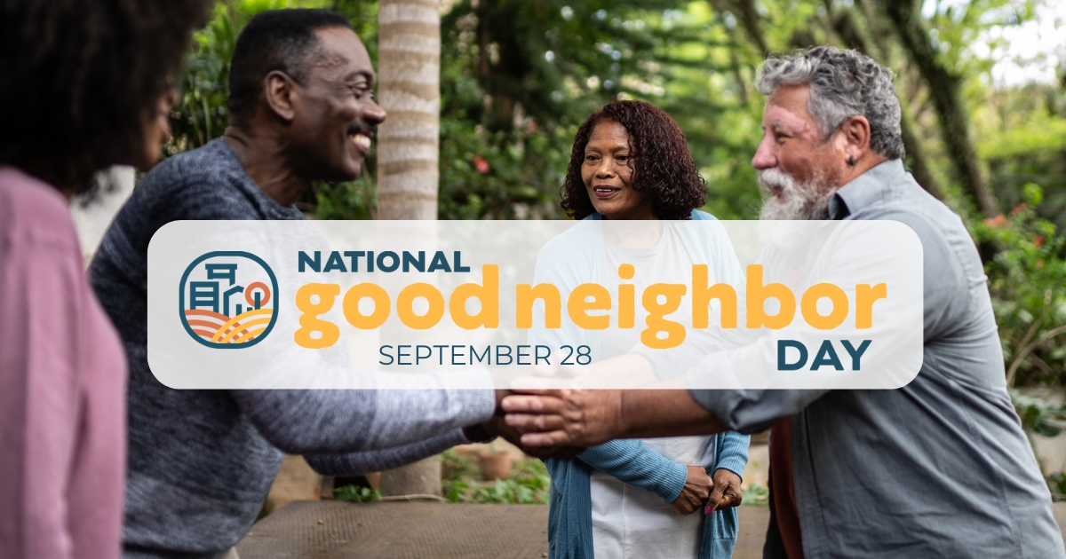 People shaking hands outdoors to celebrate National Good Neighbor Day.
